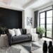 Salon moderne en noir blanc gris avec canapé anthracite et coussins blancs