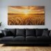 Tableau paysage coucher de soleil au-dessus d'un canape anthracite dans un salon oriente nord